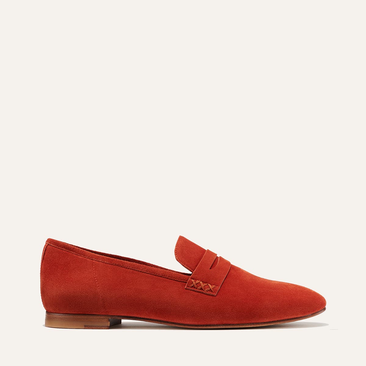 Margaux's classic and comfortable Penny loafer, made in a soft, sedona orange Italian suede