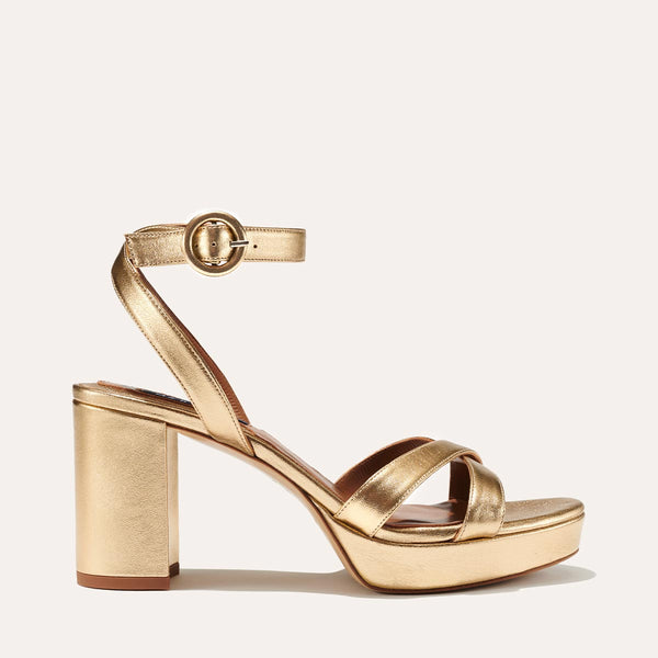Margaux's classic and comfortable Platform Sandal in gold metallic nappa leather with crossed straps and a walkable block heel