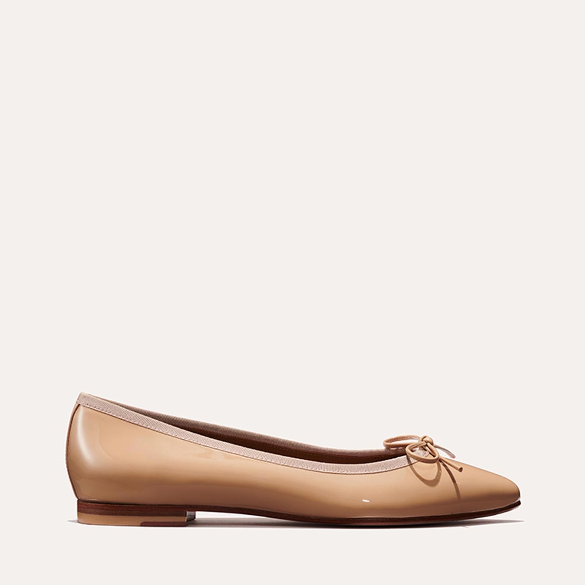 Margaux's classic and comfortable Pointe ballet flat in nude patent Italian leather with an elegant pointed toe