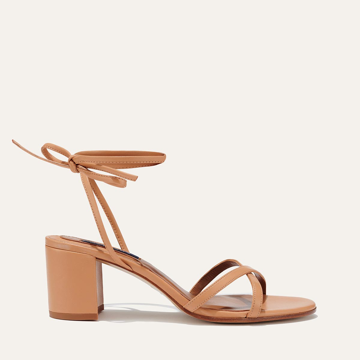Margaux's strappy Soho Sandal with ankle ties, made in Spain from soft, nude Italian nappa leather