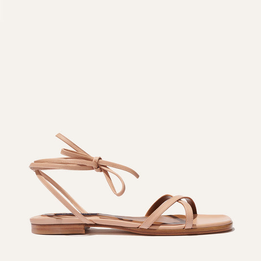 Margaux's classic strappy Wrap Sandal with ankle ties, made in Spain from soft, nude pink Italian nappa leather